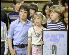 , Caroline and  honor Harry with an award