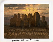 Cipher letters in the sand in a photo taken by Mark Meltzer.