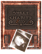 "Sweet Charity:" she gives and takes away.