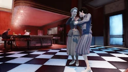 A pair of women sway to the music.