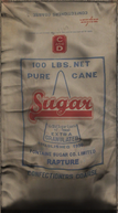 Bag of coarse sugar manufactured by Fontaine Sugar Co. Limited.
