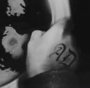 Comstock's tattoo in Burial at Sea - Episode 1.