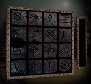 The front of the 4x4 grid of the Metal Box Puzzle.