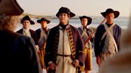 Captain Hume accompanied by several Royal Marines.