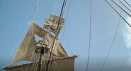 The foremast of the ship is shattered by cannonfire.