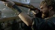 Dooley firing a musket during the Invasion of Nassau.