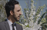 Agent Aram being emotional at Elizabeth's funeral