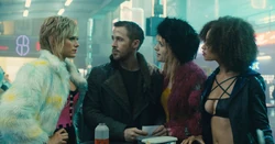 Mariette and the doxies meeting with K outside of Bibi's