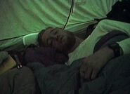 Josh lying in the tent in the morning