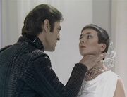 Travis grabbing Servalan's throat Weapon