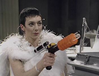 Servalan holding Imipak to fire Weapon