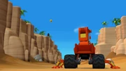 Blaze becomes a wrecking crane to knock away Crusher's pineapples.