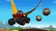 ...and dodges mud bubbles as a truckodactyl.