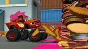 As a bulldozer, Blaze tries to scoop away giant walls of food.