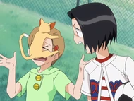 Karin is startled when Raku lands on Yuzu's face.