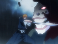 Ichigo tears his Zanpakutō through Grand Fisher's side.