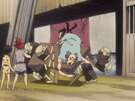 The old man knocks over his table due to Renji and his friends' plan.