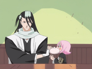 Byakuya silences Yachiru with a dumpling.