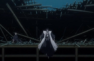 Kenpachi jumps down from the ruined building.