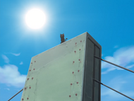 Yoruichi sits on top of a bridge while watching Karakura Town.