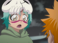 Nel is astonished by Ichigo saving her life.