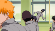 Uryū rushes passed Ichigo's classroom.