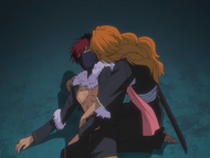 Rangiku holds an injured Noba after his plan to save Ururu fails.