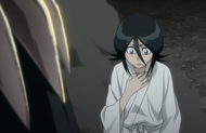 Rukia clutches the former location of her Chain of Fate.