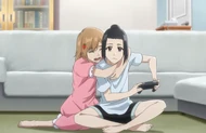 Yuzu clings to Karin during the earthquake.