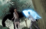 Orihime watches Sado attacking a Hollow.