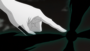 Ulquiorra begins charging Cero Oscuras at the end of his finger.