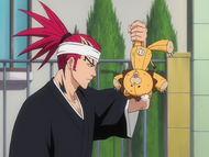 Renji finds a battered Kon atop a streetlight.