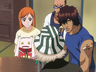 Urahara instructs Orihime and Sado to stay at his shop.