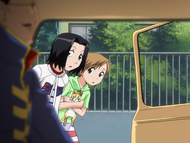 Karin and Yuzu find Don Kanonji in front of their house.