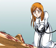 Orihime sees a motionless and badly wounded Ichigo.