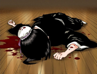 Hinamori lies in a pool of blood on the floor.