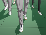 Ikkaku and the rest of the Strike Force walk through Karakura High School.