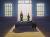 Hitsugaya and Rangiku stand over a hospitalized Hinamori.