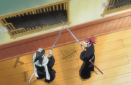 Byakuya pins Renji's blade under his own.