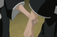 Rangiku grabs Renji's arm.