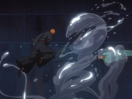 Ichigo slashes through Guhl to free Uryū from its grasp.