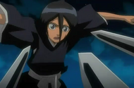 Rukia just manages to avoid Jinnai's blades.