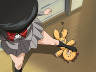 Kon peeps up Rukia's skirt.