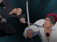 Ikkaku tricks Edrad into blocking a strike from his scabbard.