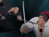 Ikkaku tricks Edrad into blocking a blow from his scabbard.