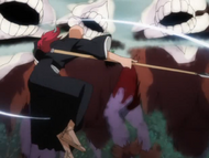 Ikkaku destroys three Arrancar clones with a single attack.