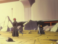 Ichigo survives Renji's attack by dodging at the last second.