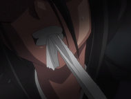 Rukia bandages her arm.