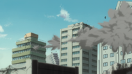 Aizen flies through buildings.