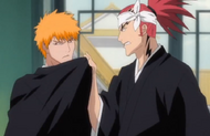 Renji grabs Ichigo by the collar.